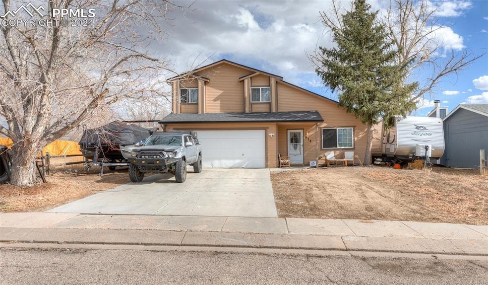 View of front property with a garage