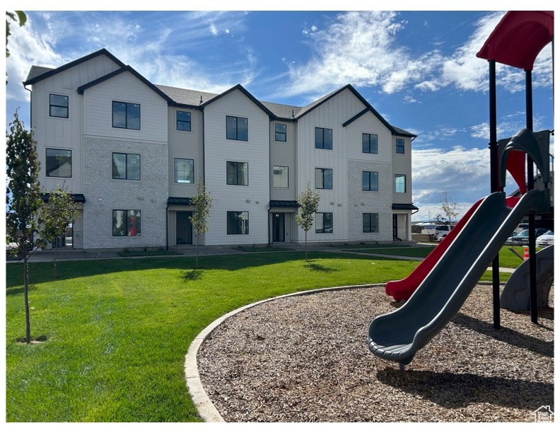 Community jungle gym with a yard
