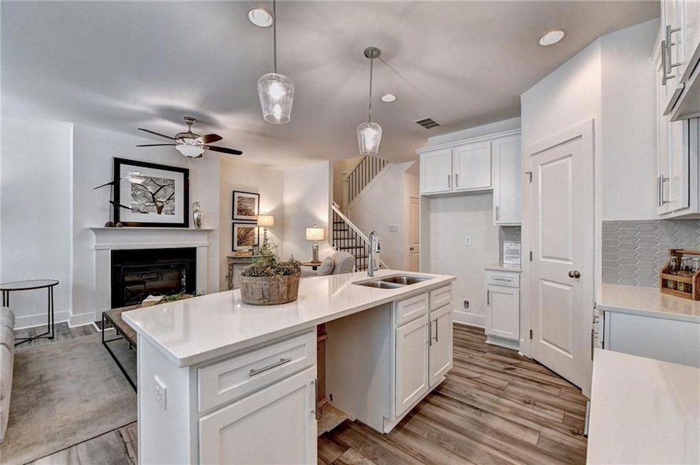 Kitchen featuring tasteful backsplash, sink, penda