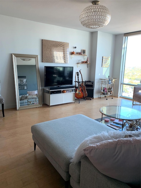 Living area with wood finished floors, expansive 