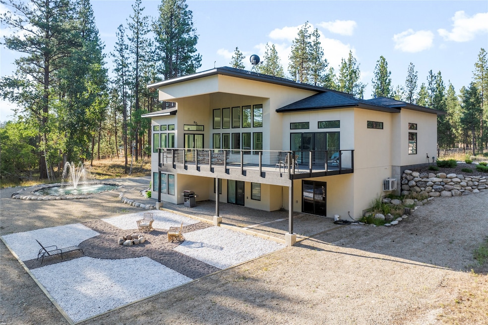 Back of property featuring a patio, stucco siding, and a Trex deck for low maintenance and durability