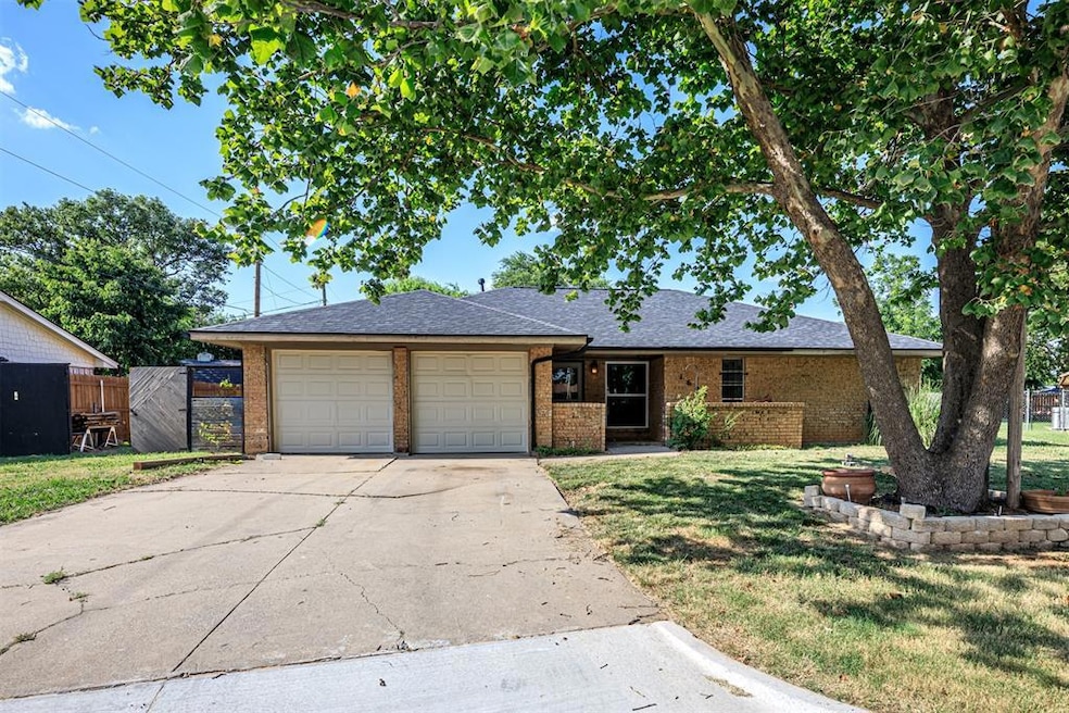 Ranch-style house with a front lawn and a garage