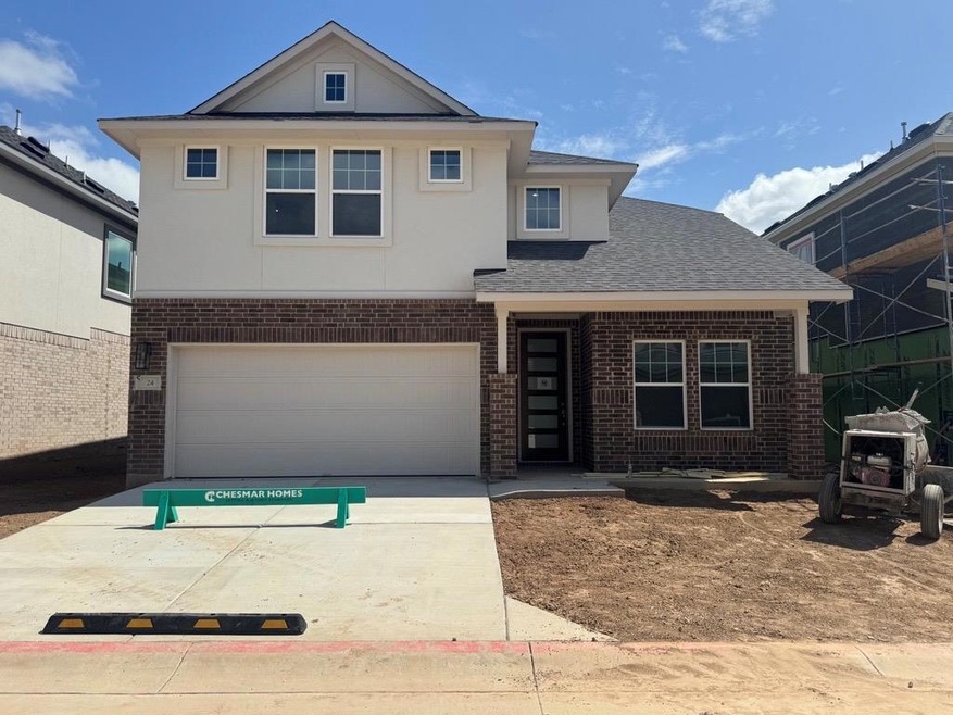 Traditional home with brick siding, an attached g