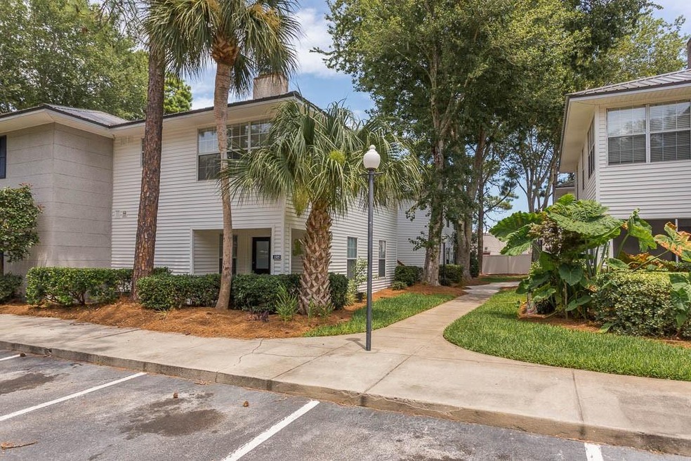 Nicely landscaped grounds with sidewalks and light