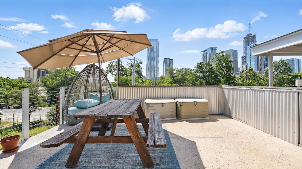 View of patio / terrace with a skyline view and f
