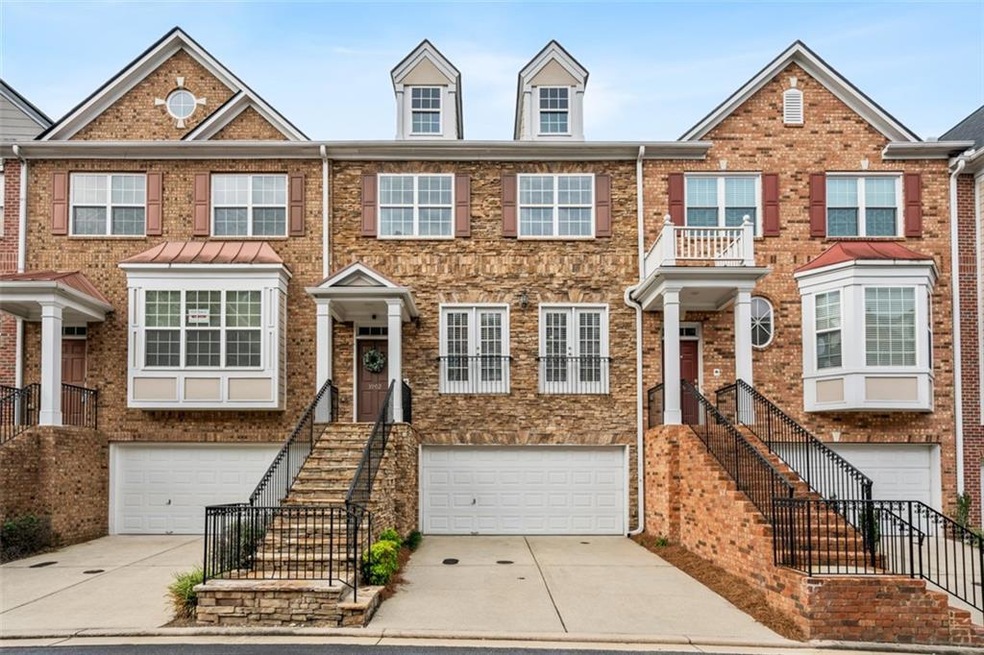Townhome / multi-family property featuring a garag