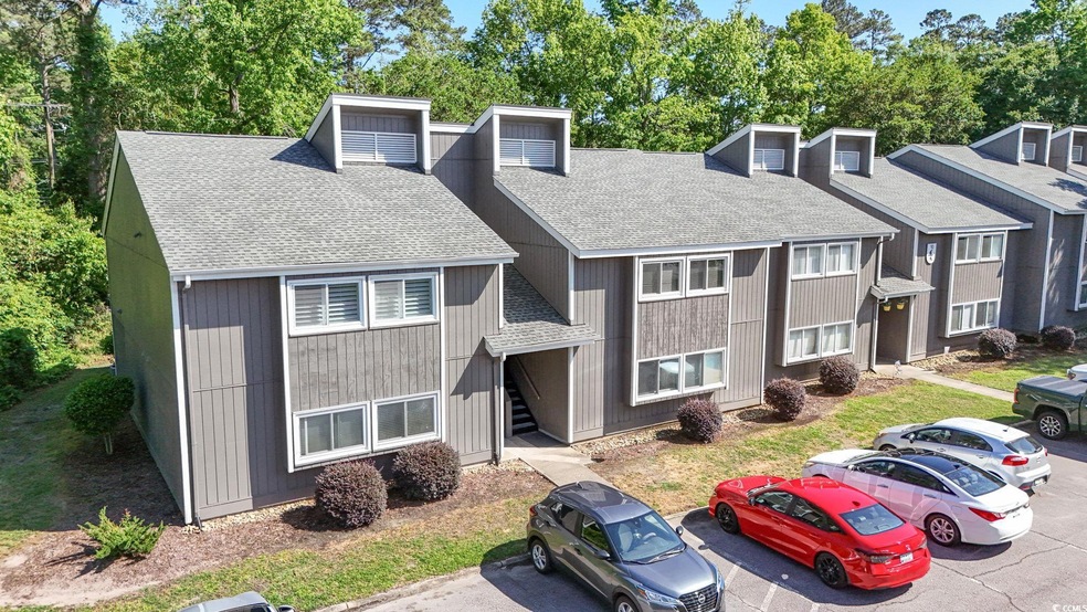 View of front of property featuring roof with shin