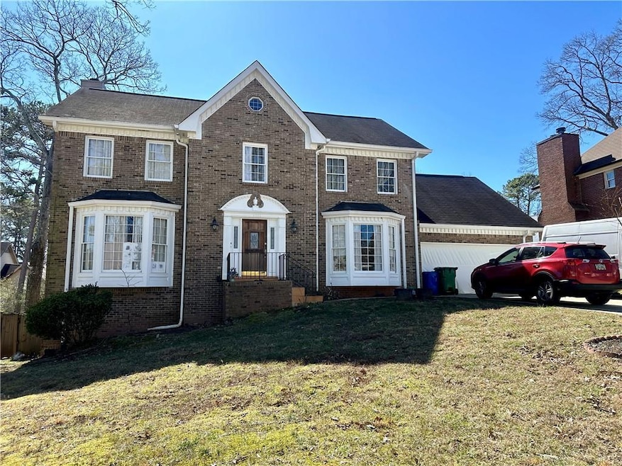 View of front of house featuring a front lawn