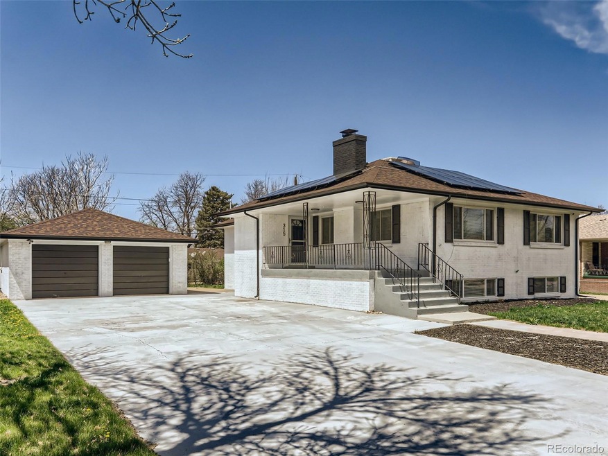 Front of house with large driveway and big front p