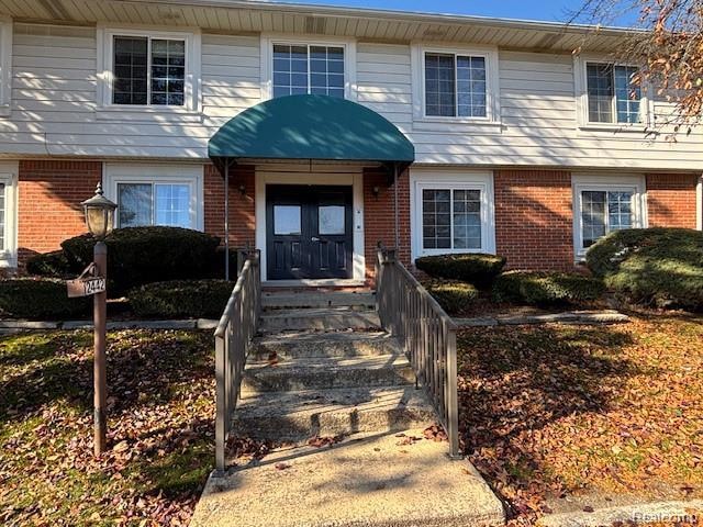 Property entrance with brick siding
