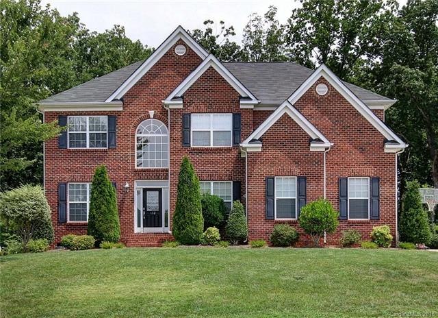 Gorgeous brick front home with side load garage in