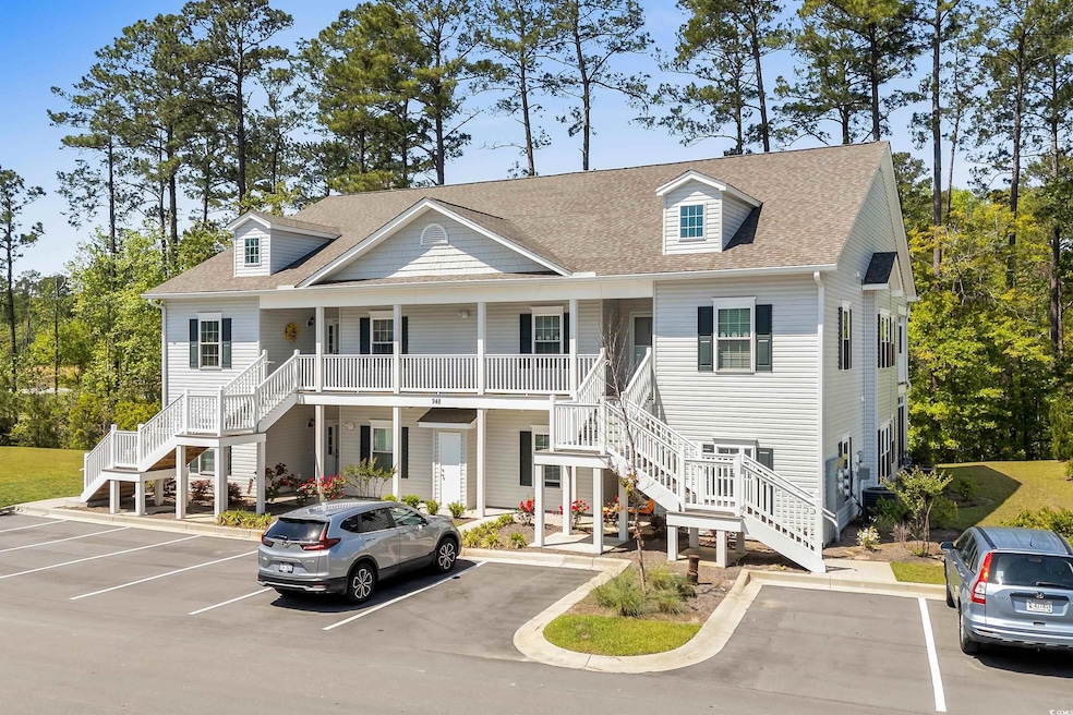 View of front of property featuring stairway, a po