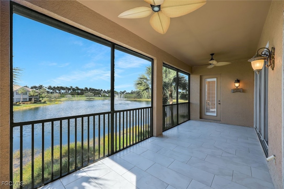 Unfurnished sunroom featuring a water view and a textured wall