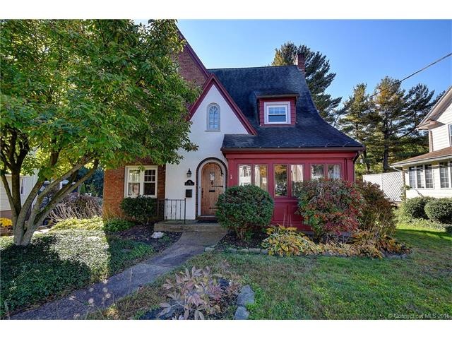 Lots of curb appeal for this colonial with a Tudor