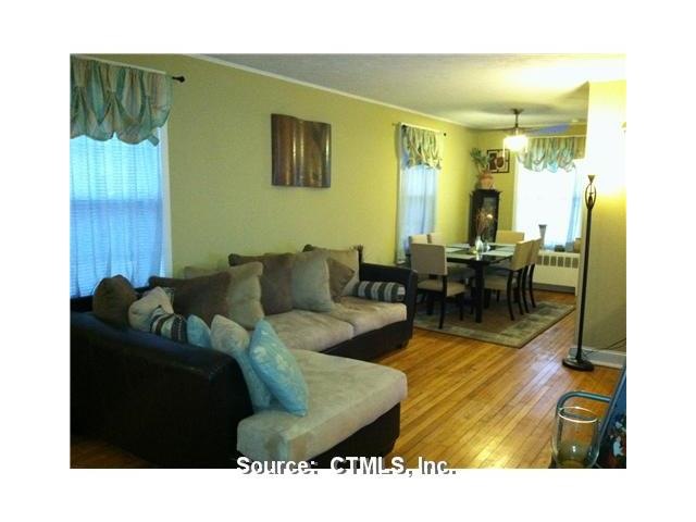 Living Room. SPACIOUS ROOM WITH HARDWOOD FLOORS.