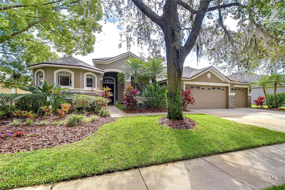 Step into tranquility with this beautifully designed and landscaped home