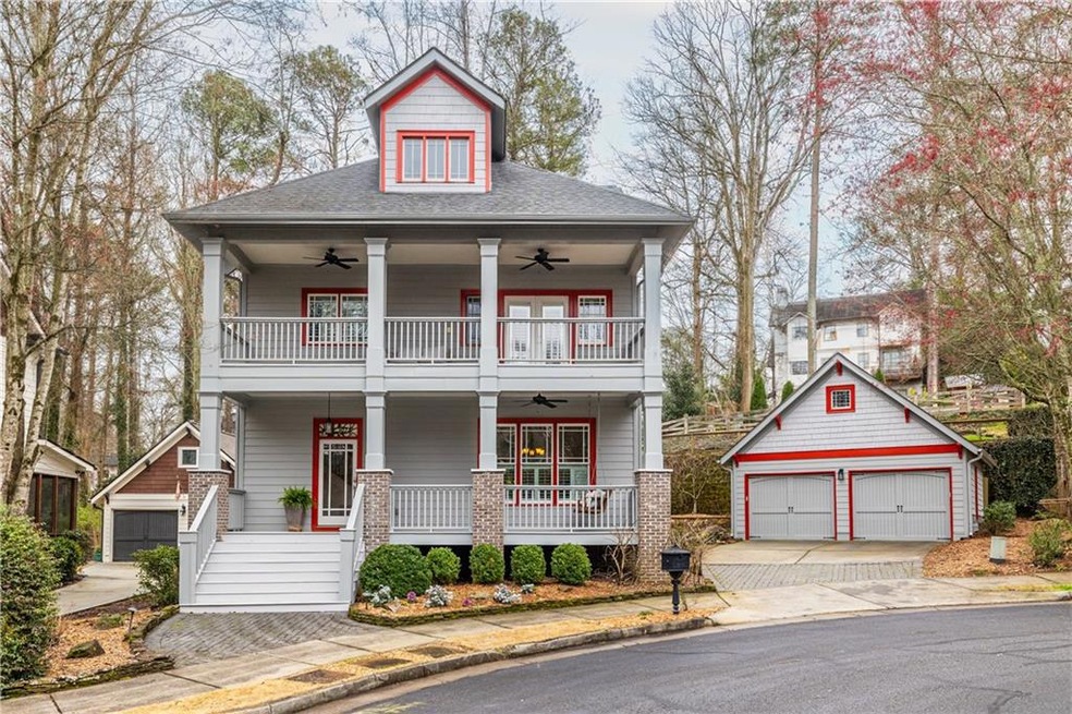 Front of home with balcony, porch and garage