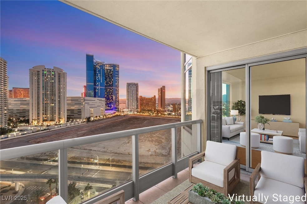 Virtually Staged Balcony offers breathtaking, panoramic views of the dazzling Las Vegas Strip.