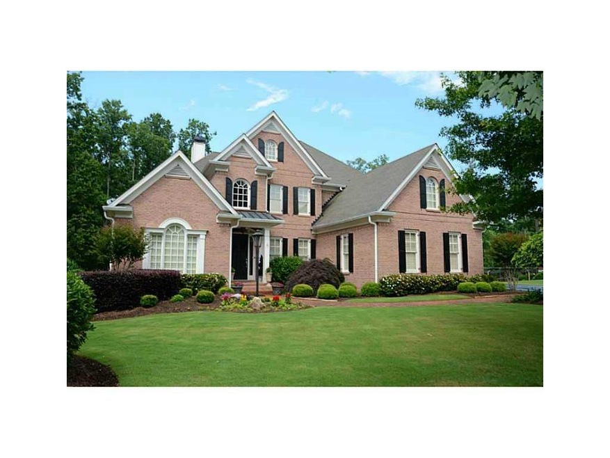 Exterior Front. Lovely 4 sided brick home with 3 c