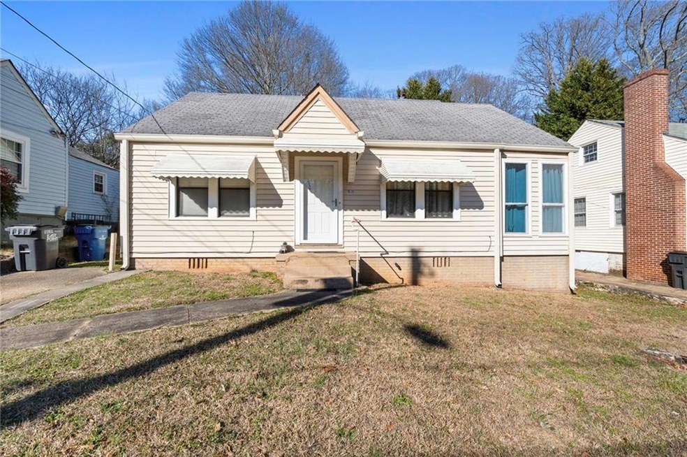 Bungalow-style home featuring a front lawn