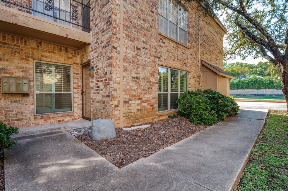 Property entrance featuring brick siding