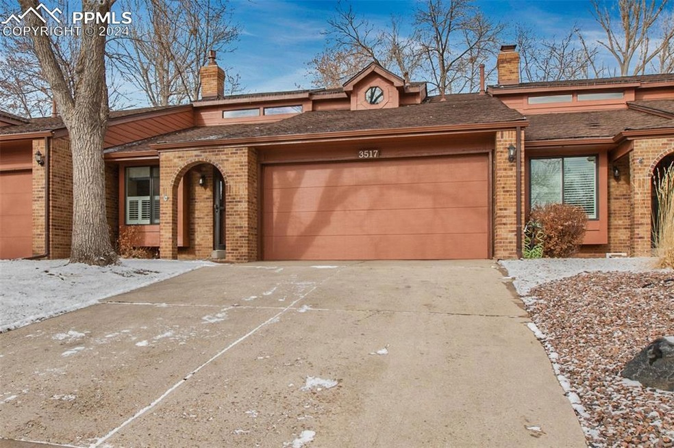 Front of property with an extra big driveway and t