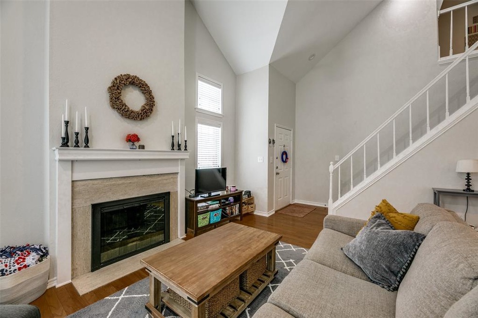 Soaring ceilings in living room with a fireplace