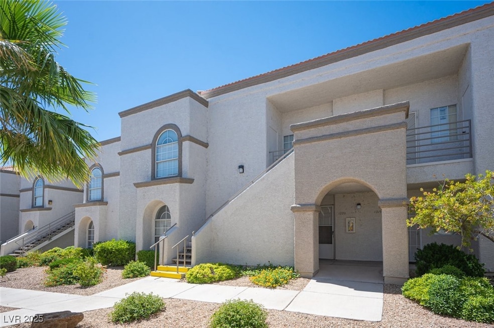 Mediterranean / spanish house featuring stucco siding and stairway