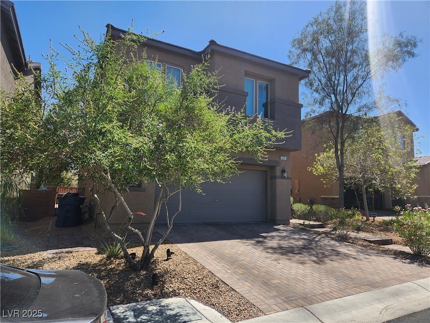 View of front of home featuring decorative drivewa