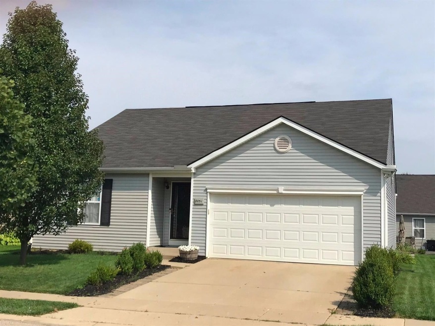 Front of home with mature landscaping