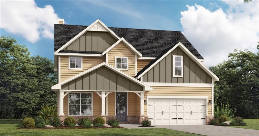 Craftsman-style house with a front lawn and a gara
