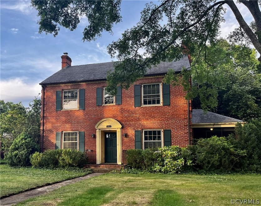 Colonial inspired home with a front yard