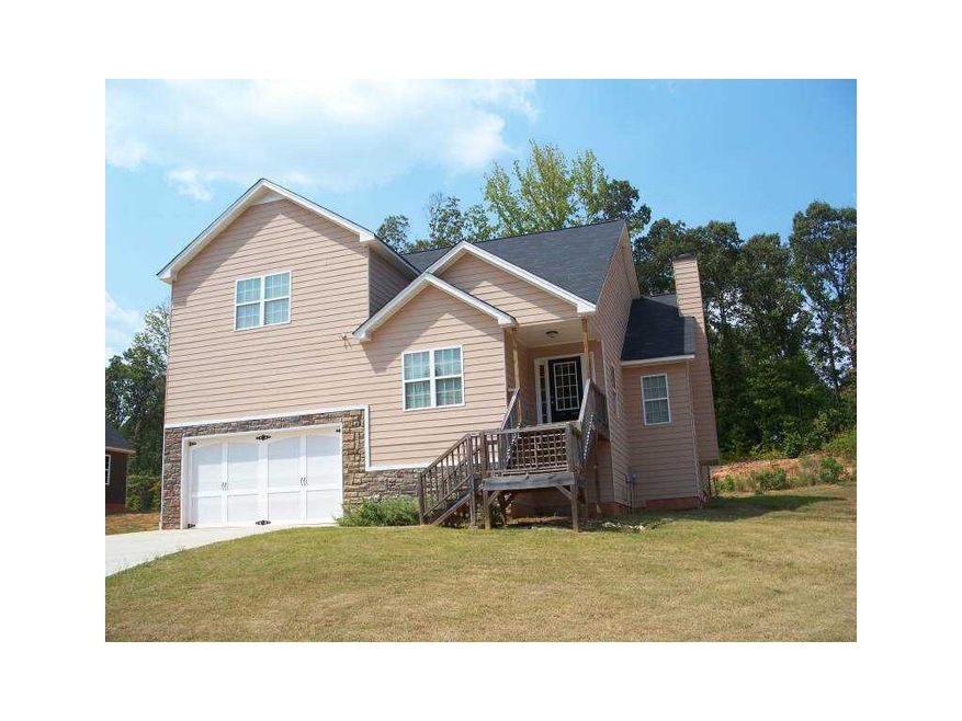 Exterior Front. Hardiplank and stone accented exte