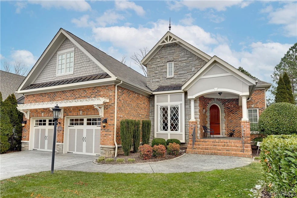 View of front facade featuring a garage