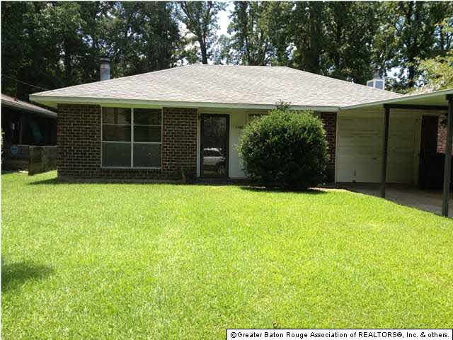 Home has enclosed garage and additional covered pa