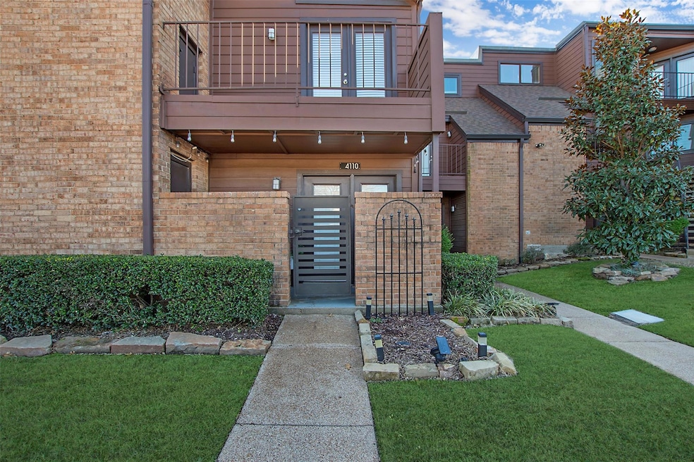 View of exterior entry with a balcony, a gate, fen
