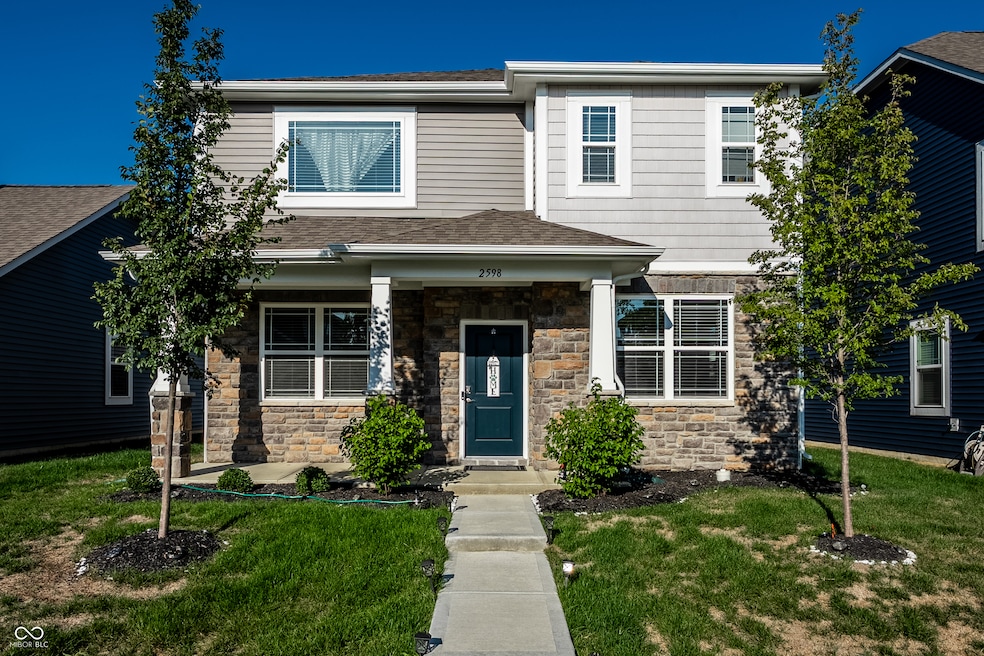 front featuring stone siding
