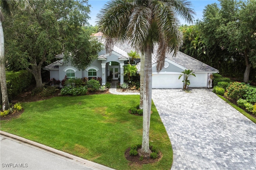 View of front of house featuring decorative drivew