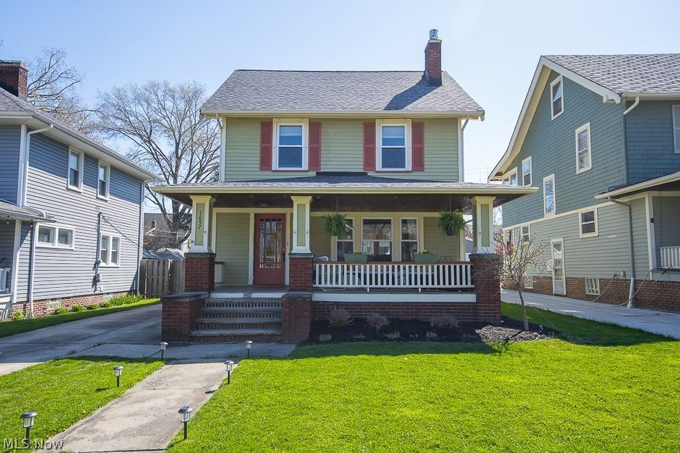 View of front of house featuring a front yard and covered porch