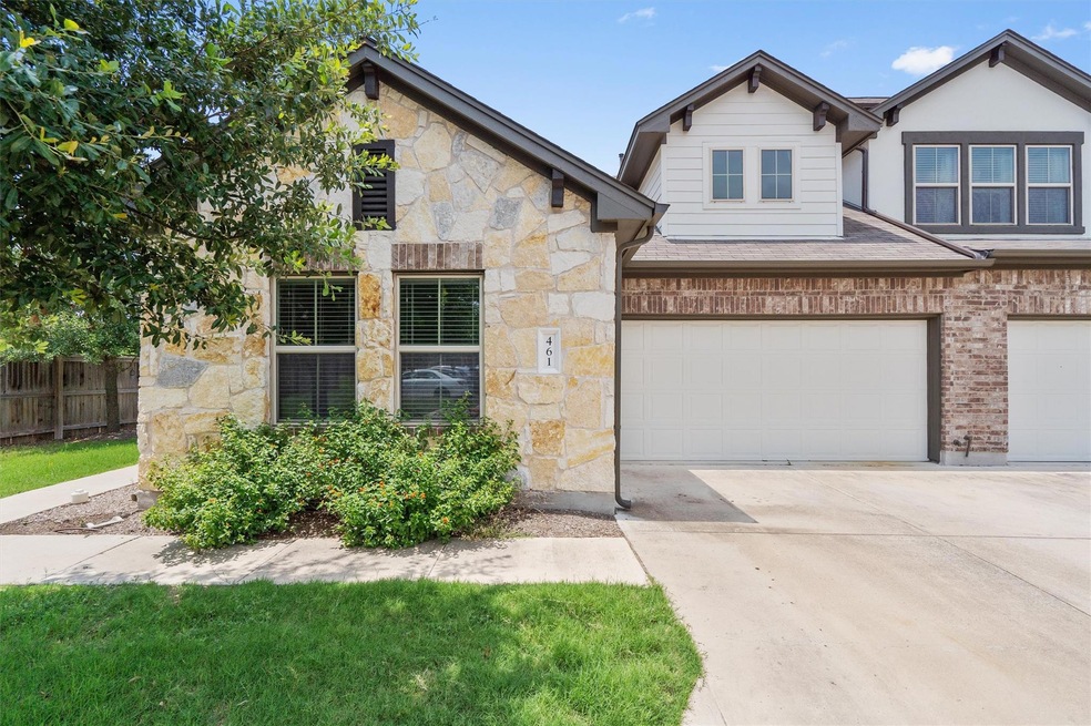 View of front of home featuring stone siding, an 