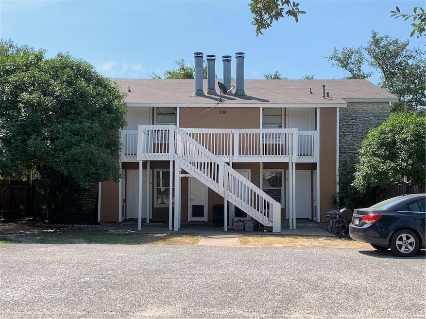 View of property featuring stairway