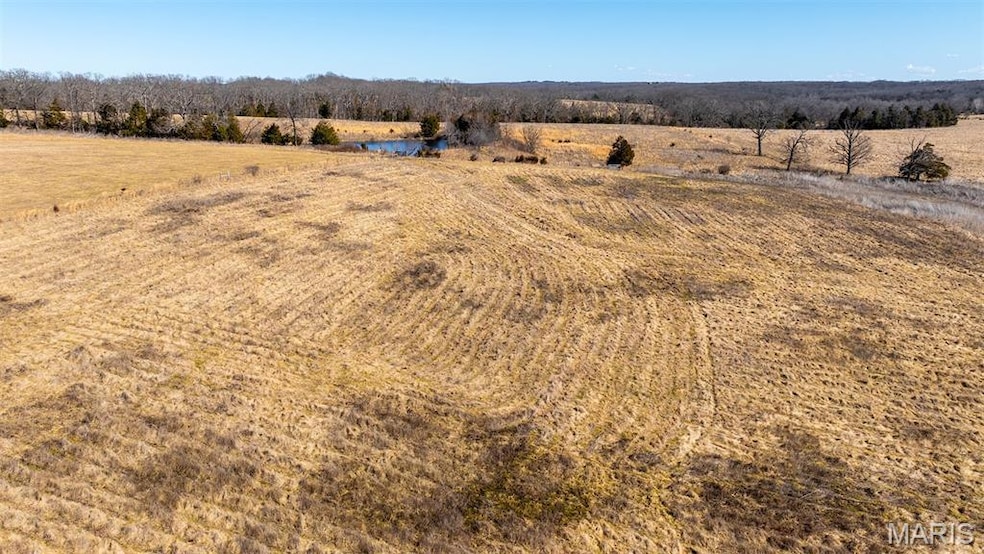Aerial view of sparsely populated area with a nearby body of water