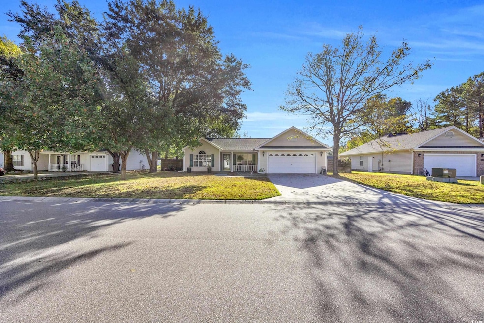 Single story home with a front lawn and covered po