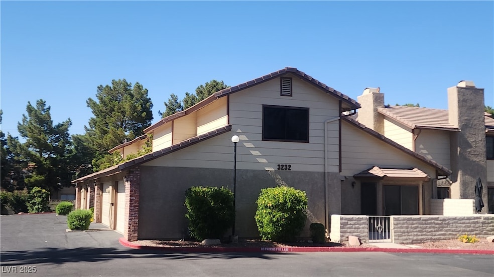 View of home's exterior with a chimney, a tiled ro