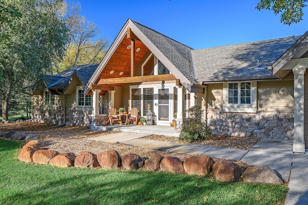 This exquisite walkout rambler residence is nestled in a serene Chanhassen neighborhood.