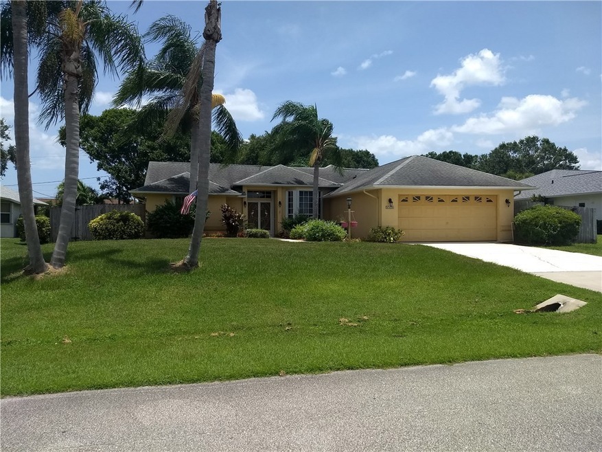 Set high above the road.  Mature Palms and lots of