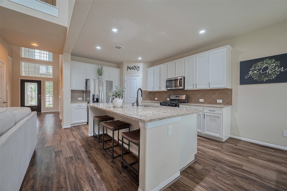 This kitchen is both functional and elegant, seaml