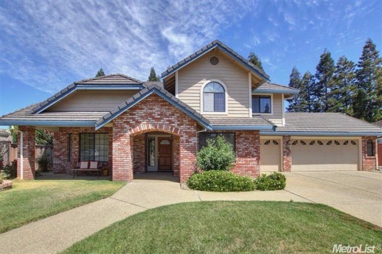 Beautiful Curb Appeal! Newer tile roof too.
