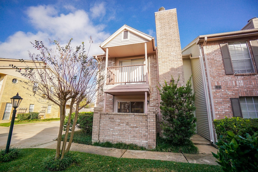 This photo showcases a charming two-story brick to