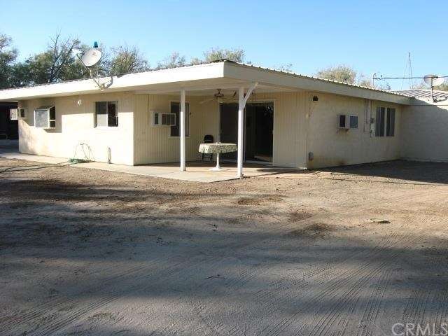 Patio with entrance into family room/library.  On 